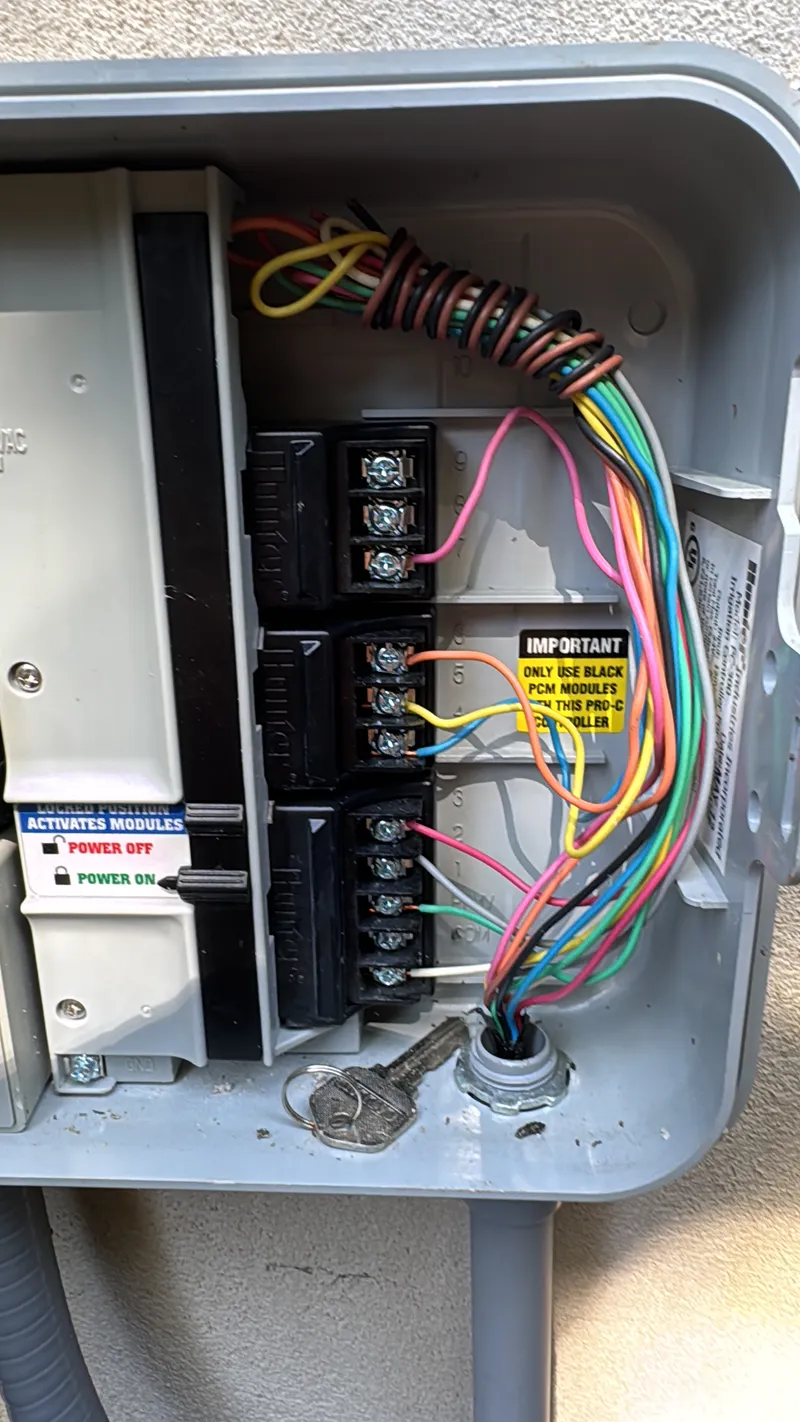 Open irrigation controller with plug-in modules and colored zone wires
